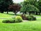 Landscaped island in front of home including weeping cherry tree