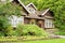 Landscaped log cottage in woods