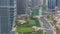 A landscaped public park in Jumeirah Lakes Towers timelapse, a popular residential district in Dubai.