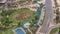 A landscaped public park in Jumeirah Lakes Towers timelapse, a popular residential district in Dubai.
