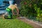 Landscaper Cut Natural Grass Turfs to Size