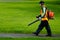 Landscaper operating petrol Leaf Blower