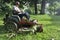 Landscaper on riding lawn mower