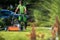 Landscaper with Scarifier Machine Taking Care of a Lawn