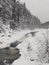 Landscapes of Russia - a river with a waterfall in winter