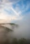 Landscapes of Siberia. Early morning on the Kiya river. Fog over a forest in the mountains.