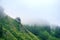 Landscapes of Siberia. Early morning on the Kiya river. Fog over a forest in the mountains.