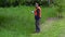 Landscaping manager take pictures on smart phone near the bad quality cutting grass
