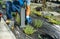 Landscaping Worker Installing Bulb Inside Small Garden Light Post