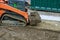 Landscaping works on the bulldozer moves soil digging ground construction