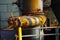 Landschaftspark Duisburg, Germany: Close up of isolated black and yellow striped rusty old wheel of control valve