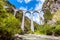 Landwasser Viaduct over river, Filisur, Switzerland. It is landmark of Swiss Alps. Red train runs on high railroad bridge in