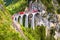 Landwasser Viaduct in summer, Filisur, Switzerland. It is landmark of Swiss Alps. Nice Alpine landscape. Red train of Bernina
