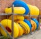 LANESBORO, MN - 26 AUG 2019: Stacks of yellow and blue inner tubes