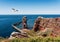 Lange Anna sea stack rock on Heligoland Island against blue sea and clear sky