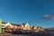 LANGEBAAN, SOUTH AFRICA, AUGUST 20, 2018: A sunset street scene, with businesses and vehicles, in Langebaan in the Western Cape