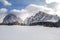 Langkofel and Plattkofel Panorama in the Dolomites from Monte Pana. Mountain Peaks hidden by Clouds. Snow covered Sassolungo and