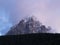 Langkofel during Sundown seen from La Selva in Val Gardena. The Sassolungo, Lang Kofel covered in Snow in Spring with clouds