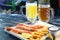 Langoustines and beer. Beer and seafood snacks. Langoustines, beer, squid rings.