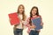 Language courses for youth. Girls with school textbooks white background. School concept. We love study. Pupils carrying