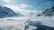 Lanscape shot of frozen river between snowy alpine mountain freeride slope on a sunny winter day and blue sky