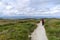 Lanscape of Wicklow way with a girl in the way and Dublin in the background