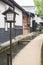 Lantern in alley of historical village Furukawa in Hida, Gifu prefecture, Japan. Old town with water canal