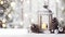 Lantern with burning candle, pine cones and silver balls on wooden board surface.