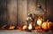 Lantern with candle and pumpkins autumn composition over blurred wooden background. Rustic style. Copy space