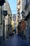 Lantern and church bell tower at the end of narrow street in Sorrento,Italy