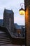 Lantern glowing in alley tower in background mont saint michel france