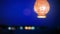 Lantern hanging near beach on blurred night sky