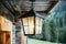 Lantern is hanging in on the veranda of an olden wooden hut