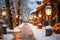 Lantern-lit path to cozy apres-ski village. Winter magic awaits in this enchanting setting