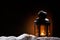 Lantern in the night on snow