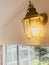 Lantern sconce. Wall lamp on the glass door.