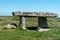 Lanyon Quoit dolmen neolithic tomb between Carn Galver hills and Greenburrow Engine House tin mine ruins in Cornwall