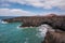 Lanzarote landscape. Los Hervideros coastline, lava caves, cliffs and wavy ocean.