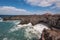 Lanzarote landscape. Los Hervideros coastline, lava caves, cliffs and wavy ocean.