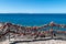 Lanzarote / Spain - 20 august 2020: Chain padlocks in the foreground and sea in the background. Lanzarote Island, Canary Islands