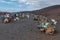 Lanzarote, Spain; August 30, 2019: Camels and tourists on camel safari tour in Timanfaya National Park