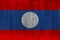 Laos flag painted on old wood plank