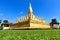 Laos travel landmark, golden pagoda wat Phra That Luang in Vientiane.