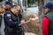 A LAPD Traffic officer makes a traffic accident investigation by interviewing witnesses and driver