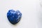 Lapis lazuli heart on a white background