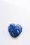 Lapis lazuli heart on a white background