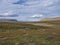 Lapland landscape with blue lake, snow capped mountain at Kungsleden hiking trail near Saltoluokta, Sweden. Wild nature with