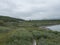 Lapland landscape at Virihaure lake with sami village Staloluokta houses and cottage, snow capped mountains and birch