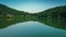 Lapota lake with green mountains reflections located in Georgia country.