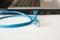 Laptop and blue networking cable